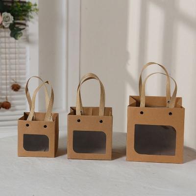 China Hot Selling Handmade Luxury Packaging Paper Bag Portable Color Printing Take Away Flower Gift Box With Window for sale