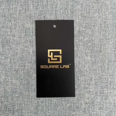 China Sustainable Fashion Private Swing Tag With Gold Foil Logo Cardboard Hot Stamping Custom Hangtag With Printing Logo for sale