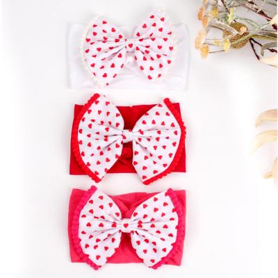 China Soft Newborn Baby Headbands Valentine's Day Bow Elastic Hair Band Accessories Printed Love Headband For Baby Skin Affinity Infant Headbands for sale