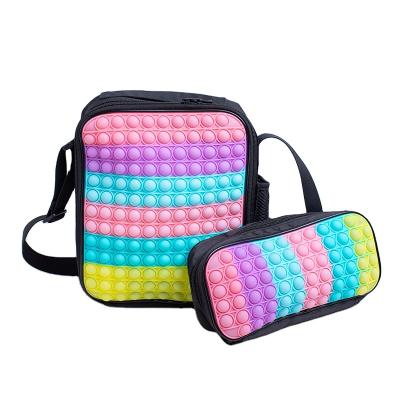 China 16 Inch Anti-theft Silicone Rainbow Toss Bag Bookbag Children School Bags Snap Button It Backpack for sale