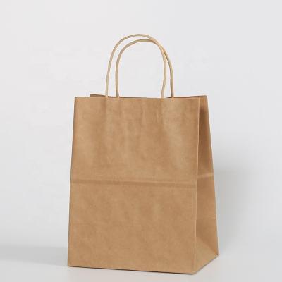 China Recyclable Eco Friendly Food Packaging Brown Twisted Kraft Paper Handles Bag , Customized Printing Recycled Paper Shopping Bags for sale