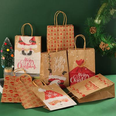 China Wholesale Cheap Price Recyclable In Stock Christmas Candy Wrapping Paper New Designs Printed Gift Bags With Twisted Paper Handles for sale