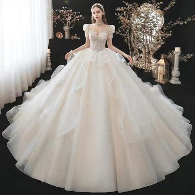 China Immediately High Quality Anti-static Boat Collar Wedding Dresses For Women A Line Wedding Equipment Long Tail High Neck Wedding Dress for sale