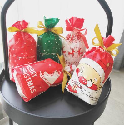 China Hot Selling Wholesale Christmas Disposable Santa Candy Bag Gift Drawstring Bag for sale