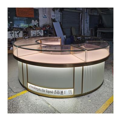 China Fashionable High End Paint Gold Jewelry Shop Display Cabinet Wood Glass Showcase Round Counter Stainless Steel Jewelry Customization for sale