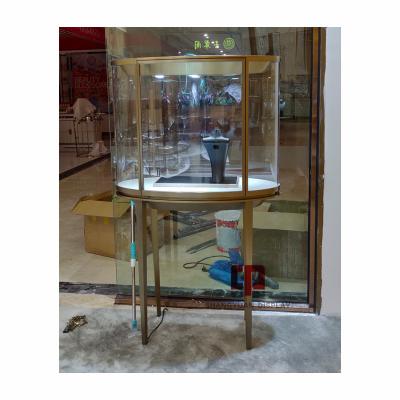 China Custom Oval Glass Jewelry Metal Stainless Steel Display Cabinet Jewelry Shop Window Display Showcase High End Manufacturers for sale