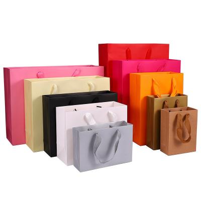 China Recyclable Printed Your Own Shopping Logo Packaging Kraft Gift Craft Eco Friendly Paper Bag With Ribbon Handles for sale