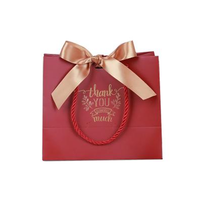 China Personalized Recyclable Wholesale Guests Thank You Wedding Gift Paper Bag With Bow for sale