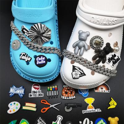 China Clog Charms PVC Waterproof Shoe Charms Soft Rubber Girls Croc Shoe Charms Custom Logo Wholesale Pvc Charm for sale