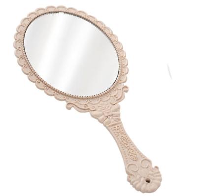 China Minimalist European Korean Pattern Portable Retro Princess Cosmetic Mirror With HD Handle For Beauty Salon Mirror for sale