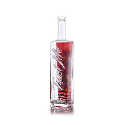 China Embossed Lettering Luxury Spirits Bottle 900g 750ml Clear Glass Bottles for sale