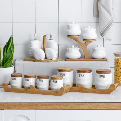 China Wholesale Kitchen Used Sealing Canister Stocked Set Ceramic Spice Jars With Bamboo Lid/Nordic Ceramic Spice Jar Set for sale