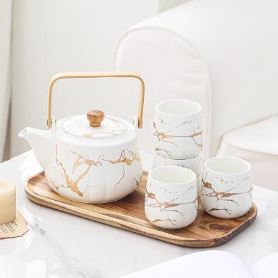 China Viable Luxury Marble White Marble Afternoon Black Gold Rim Set Gold Tea Cup Design Fashion Nordic Ceramic Tea Set With Wood Handle for sale