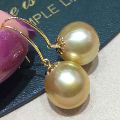 China FASHIONABLE Natural Golden Nearly Round Pearl Earrings 18k Gold Ocean Sailing Pearl Earrings 12-13mm Pure Drop Earrings for sale