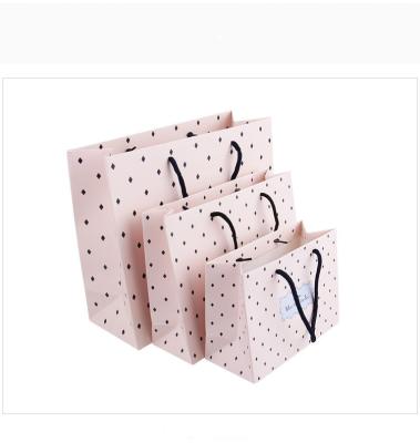 China Recyclable Birthday Gift Paper Bag Polka Dots Clothing Shopping Paper Bags for sale