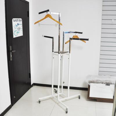 China Stainless Steel Metal 4-Way Rotating Wheel Shopping Display Stand for sale