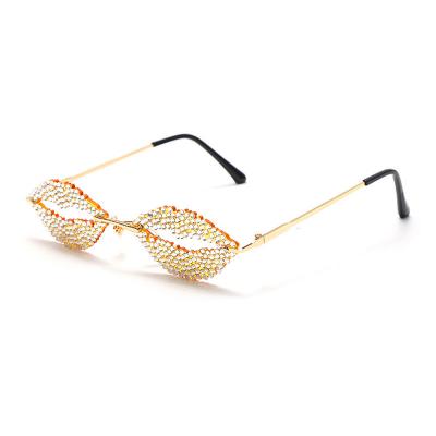 China Decorations 2021 Luxury Sunglasses Diamond Small Colored Frameless Sunglasses New Lips Zircon Personality Rimless Women Sunglasses for sale