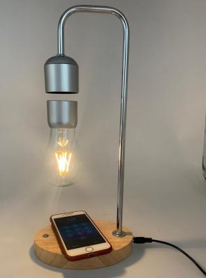 China wooden base magnetic levitation floating lamp light bulb with wireless charger for iphone cellphone for sale