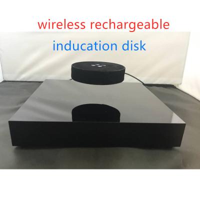 China wireless charging rechargeable levitation floating bottle display stand with inducation tray for sale