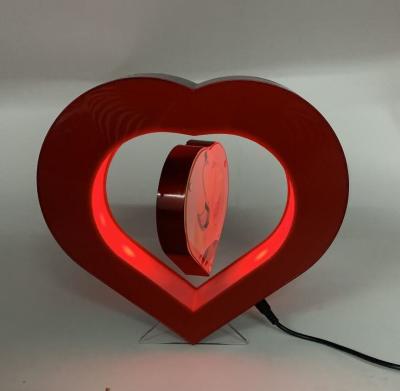 China heart shape led light magnetic levitation floating pop photo frame display racks wedding gift toys for sale