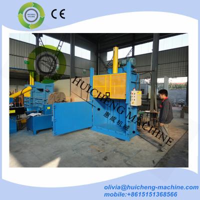 China Europen type hydraulic vertical sliding door lifting door waste paper cardboard plastic baing machine press baler for sale