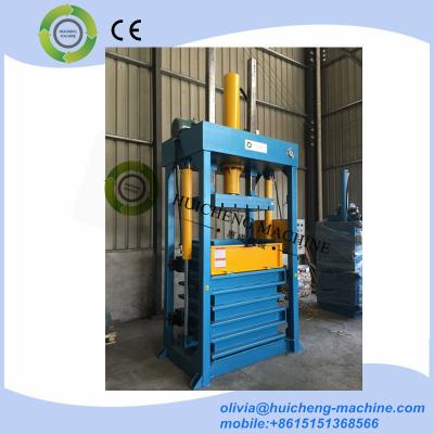 China hydraulic vertical lifting chamber used cloth and textile baling machine press compactor for sale