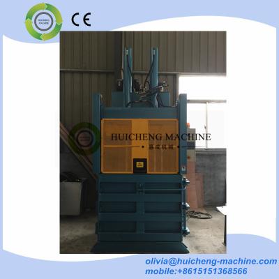 China Lifting Door Cardboard baling press machine/safety door plastic bottle baler/sliding door waste paper compress baler for sale