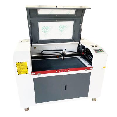 China 57 Engine 690 Ruida Water Cooled CO2 Laser Engraving Machine for sale