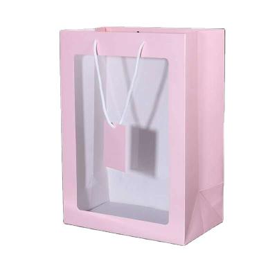 China Recycled Materials Wholesale Custom Brand Logo Printing Ivory Recyclable Shopping Gift Handles Paper Bags With Clear Window for sale