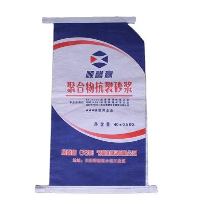 China Impact Resistance ISO9001 20KG 25KG 50KG Kraft Paper PP Woven Cement Sand Valve Concrete Bags With Block Bottom for sale