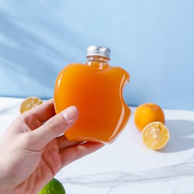 China Hot Selling Summer Plastic Beverage PET Apple Juice Drink Bottles With Metal Caps 250ml for sale