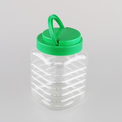 China 1100ml 37oz Food Wide Empty Popcorn Square Clear Mouth Jars With Green Handle Caps for sale