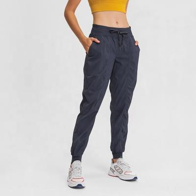 China Breathable Stylish Drawstring Nylon Gym Jogging Women Track Pants With Stripe for sale