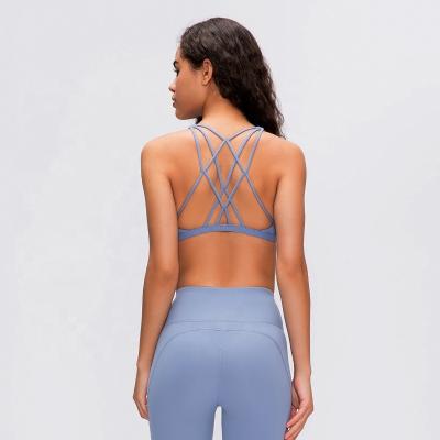 China Factory Wholesale Breathable Criss-Cross Back Shaping Women's Stretch Sports Bra for sale