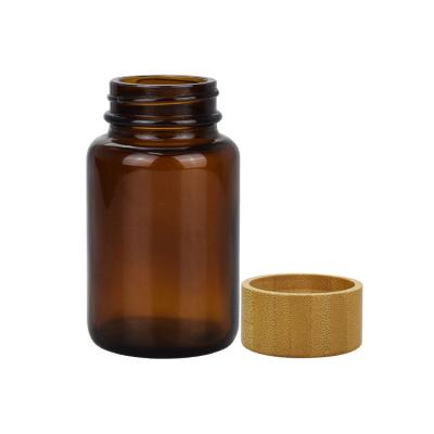 China Medicine Capsule Vitamin Bottle Packaging 60ml 100ml 120ml 150ml 200ml 250ml Wide Mouth Glass Bottle Amber Bamboo Lid For Supplement for sale