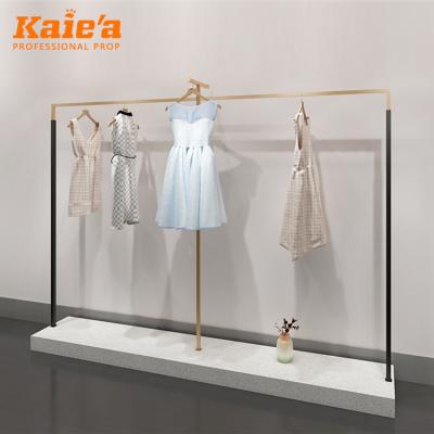 China Fashion Custom Metal Women Clothing Display Rack Brushed Finish Stainless Steel Clothes Hanging Rack for sale