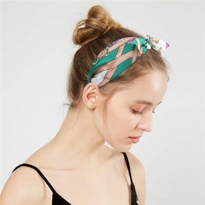 China Bohemia European and American Wide Side Knot Style Cloth Leopard Hair Circle Colorful Headwear Bunny Ears Knotted Hair Band for Women for sale