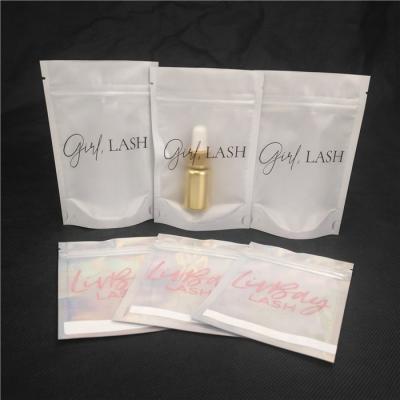 China Custom Single Layer Moisture Proof Logo Laser Cosmetic Packaging Bag Lip Gloss Whips Essential Oil Bottle Packaging Doypack Bag With Window for sale