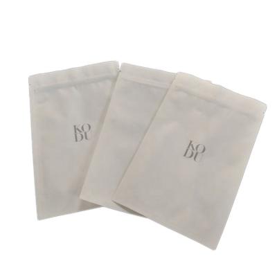 China Brown Makeup Jewelry Packaging Paper Ziplock Paper Bags Three Side Seal Moisture Proof Biodegradable White Cosmetic Pouch Ziplock Paper Bags With Circle Window for sale