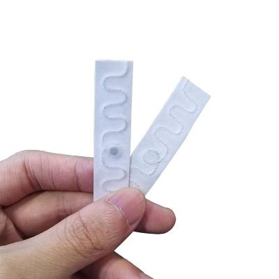 China 200 Waterproof Wash / Waterproof Cycles 13.56mhz Iron On NFC Clothes Tag Fabric Textile NFC Laundry Tag for sale