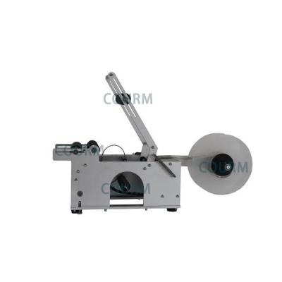 China COURM Horizontal small semi automatic manual labeling machines for round food beer bottles jars cans with coding function for sale