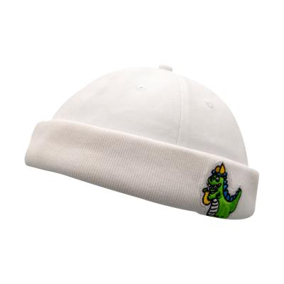 China COMMON 100% Cotton White Patch Logo Knitted Brimless Hat Docker Hat With Embroidery Dinosaur for sale