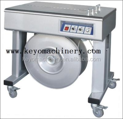 China Manual semi automatic packing strapping machine for carton box for sale