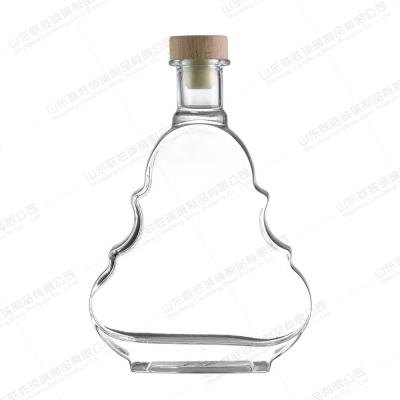 China 1L Creative Glass Bottle for Alcoholic Beverages Glass Lid Custom Label Transparent for sale