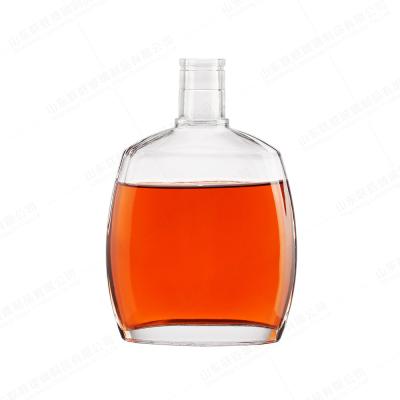 China Transparent Glass Tequila Bottle with Gold Lids Large Size and Base Material Glass for sale