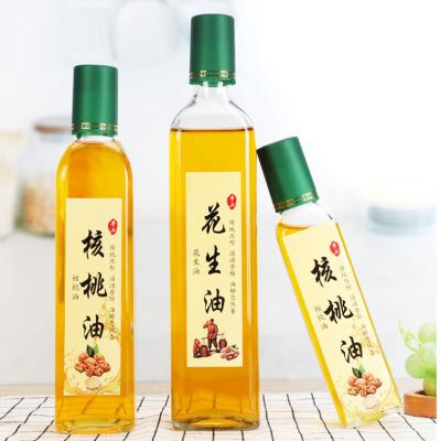 China Botellas de vidrio de aceite de oliva verde oscuro cuadrado 250 ml 500 ml 700 ml OEM ODM en venta