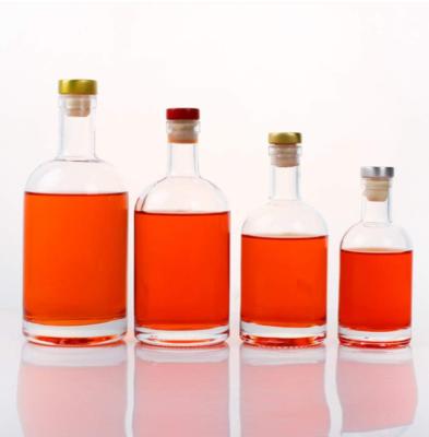 China 375ml 500ml 750ml Custom Unique Transparent Round Empty Flint Glass Liquor Bottle for sale