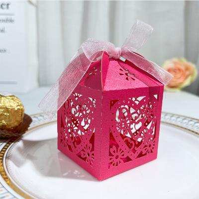 China Recycled Materials Hollow Out European Heart Pattern Wedding Candy Packaging Box for sale