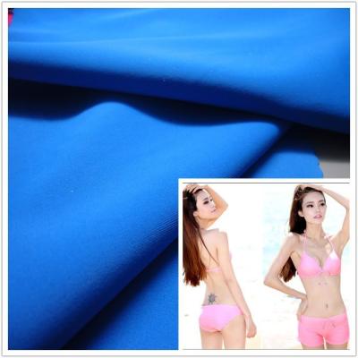 China 80% 20% plain spandex nylon underwear fabric/matte lycra fabric for swimwear/4 way stretch knitted fabric for sale