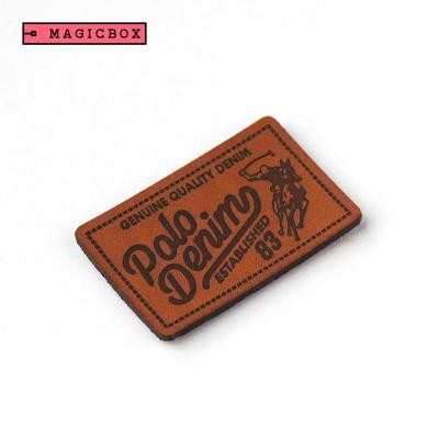 China Low MOQ factory price viable custom size emboss logo brand and pattern high quality soft PU leather label for denim apparel for sale